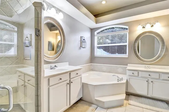 a bathroom with a sink a mirror and a bathtub
