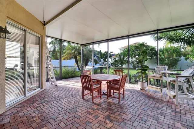 a outdoor space with chairs a table and chairs