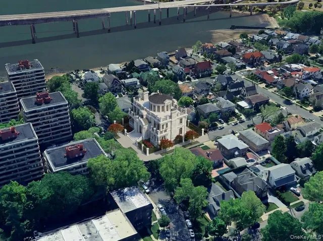 an aerial view of a house with a yard