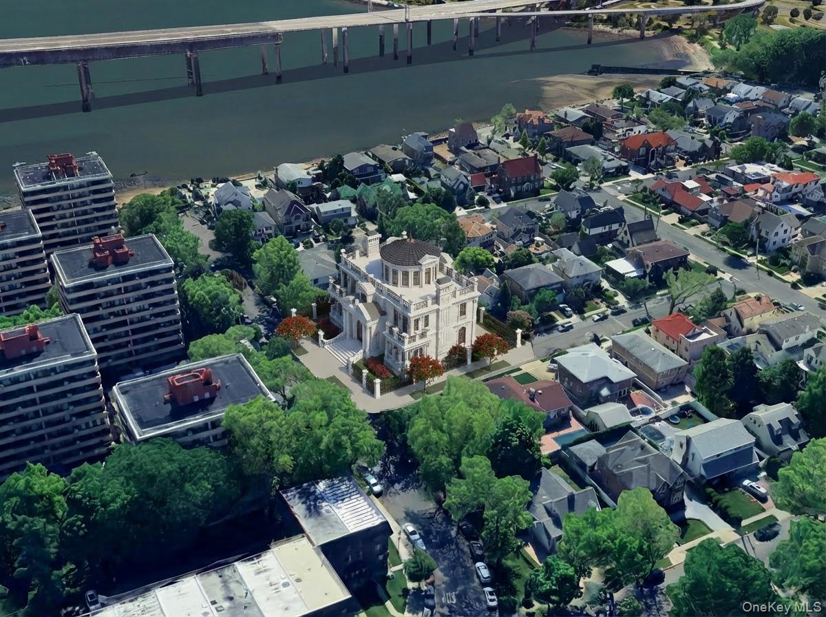 10-33 Burton Street Queens, NY 11357 - Photo 3 of 8 an aerial view of a house with a yard