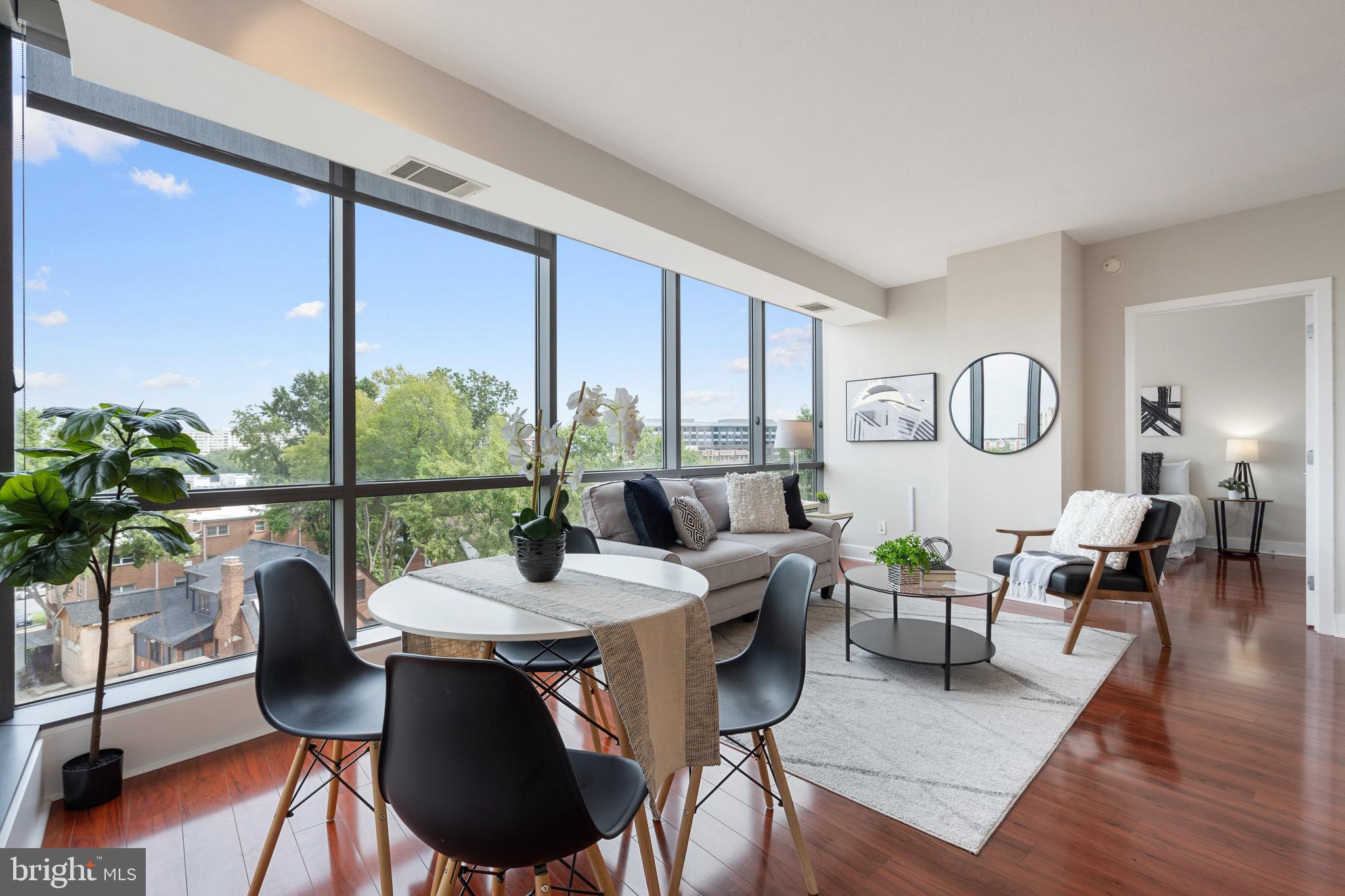 2001 15th Street North, Unit 306 Arlington, VA 22201 - Photo 14 of 54 a view of a dining room with furniture window and wooden floor