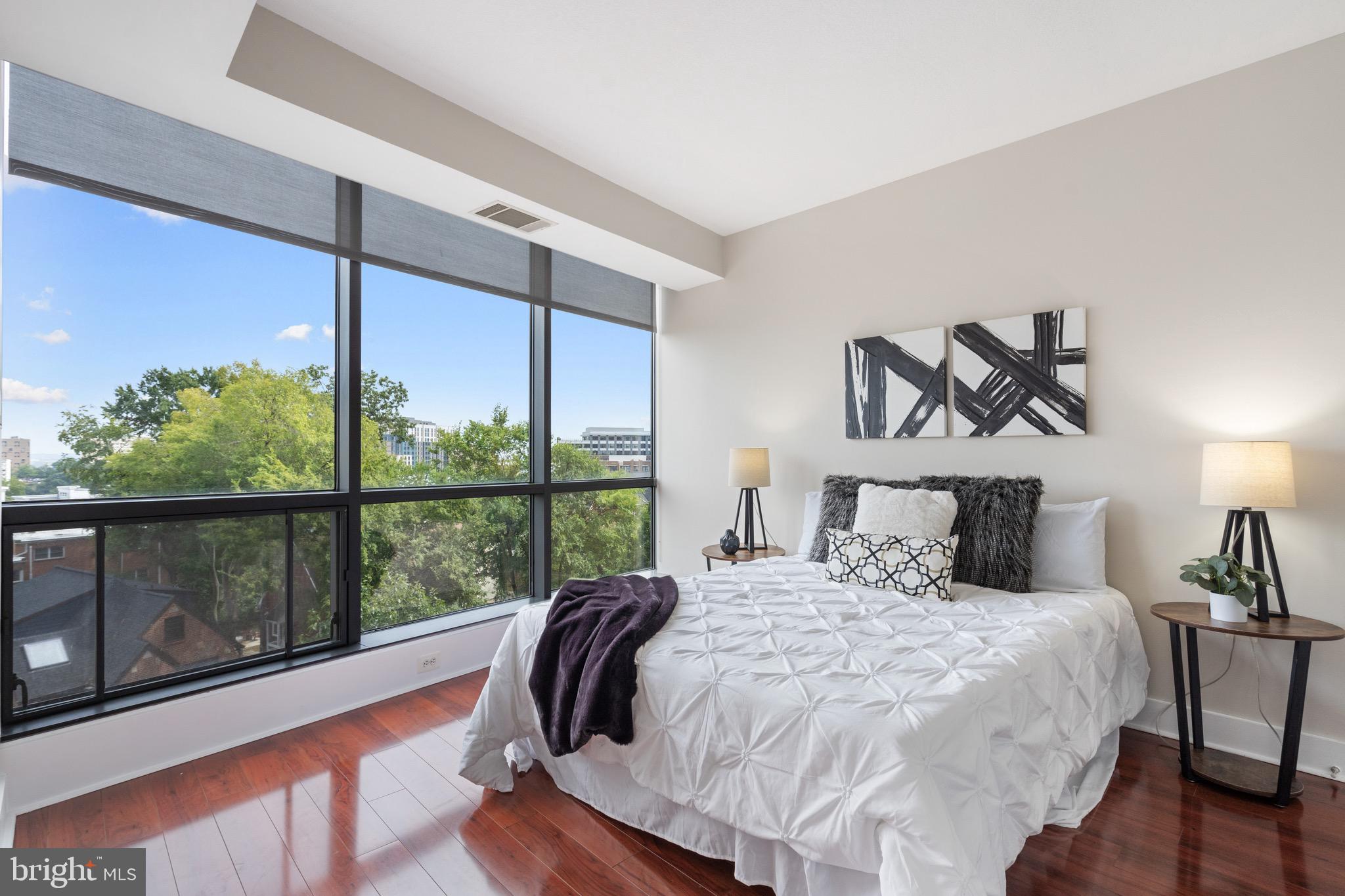 2001 15th Street North, Unit 306 Arlington, VA 22201 - Photo 21 of 54 a bedroom with a large bed and a window