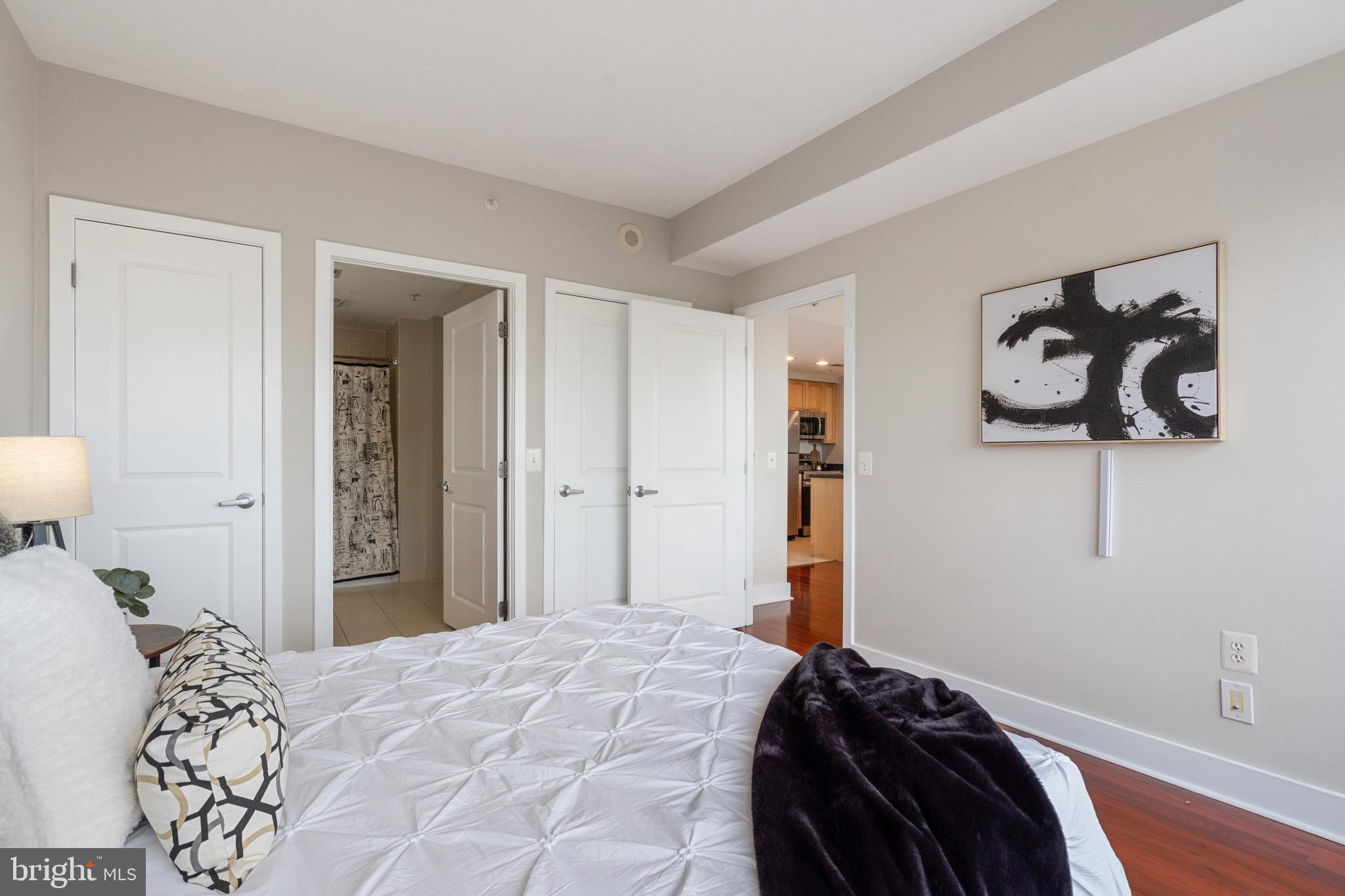 2001 15th Street North, Unit 306 Arlington, VA 22201 - Photo 22 of 54 a bedroom with a bed and a window