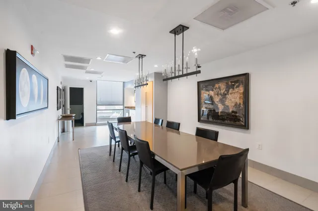 a living room with fireplace furniture and a large window