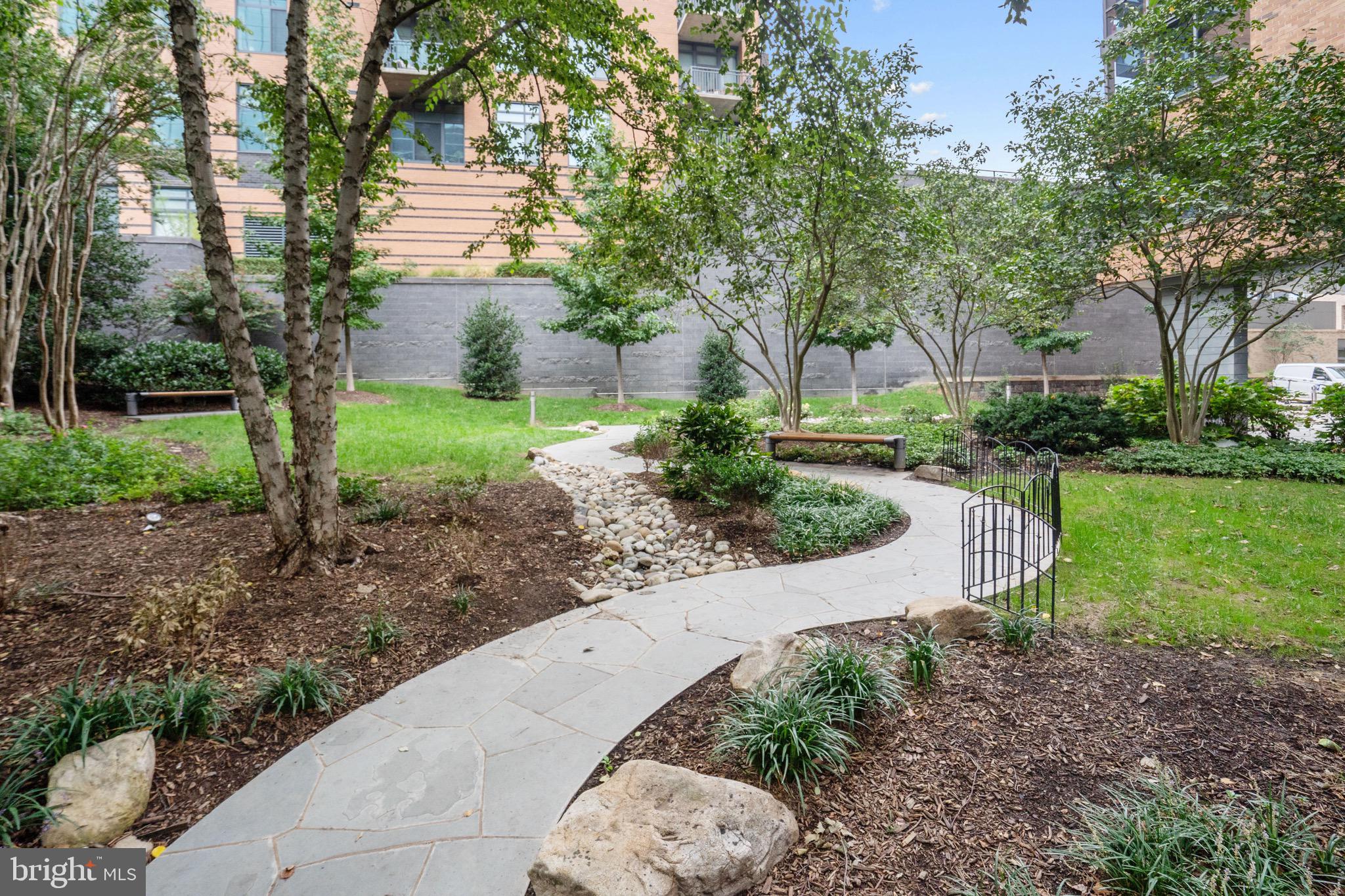 2001 15th Street North, Unit 306 Arlington, VA 22201 - Photo 54 of 54 a view of a garden with a fountain