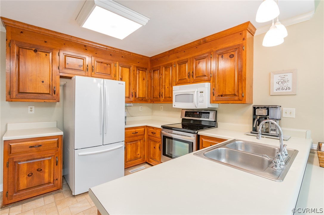 15008 Gates Mill Road Midlothian, VA 23112 - Photo 14 of 37 a kitchen with stainless steel appliances a refrigerator a sink a stove top oven a counter space and cabinets