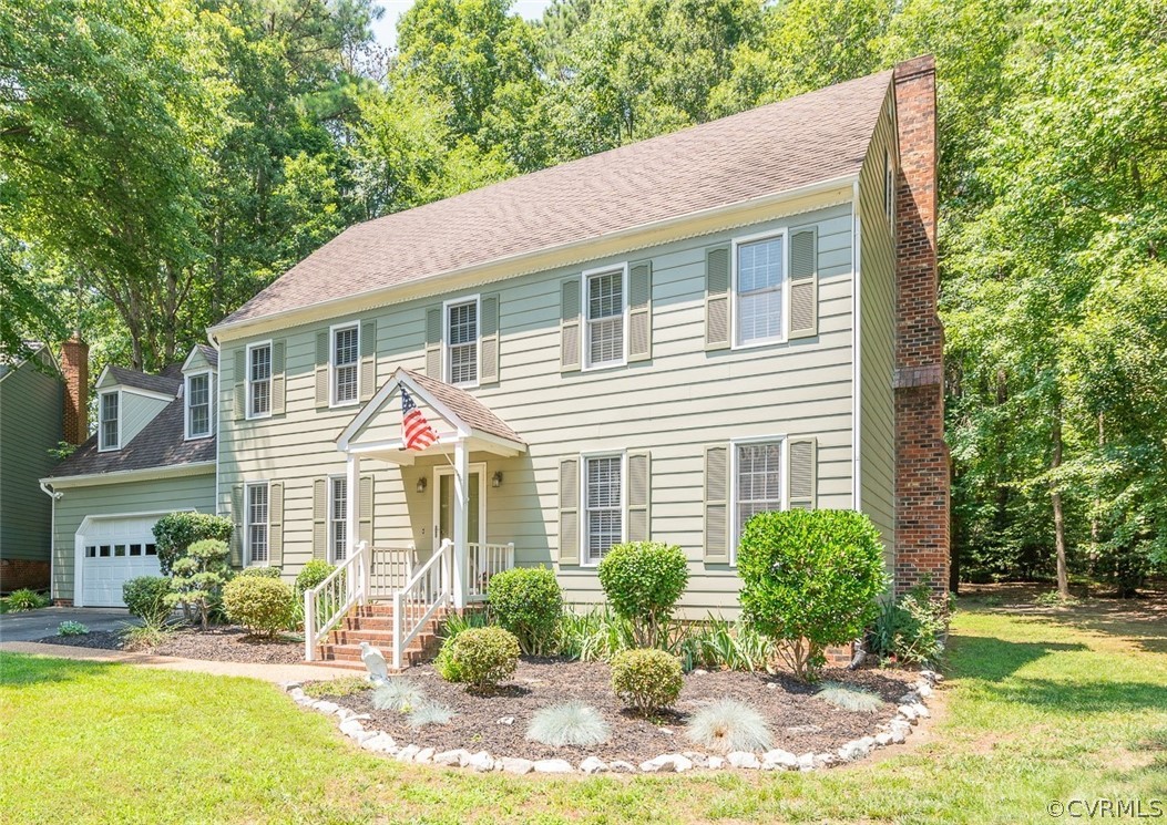 15008 Gates Mill Road Midlothian, VA 23112 - Photo 2 of 37 a front view of a house with garden