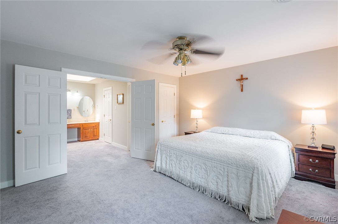 15008 Gates Mill Road Midlothian, VA 23112 - Photo 21 of 37 a bedroom with a bed and a chandelier