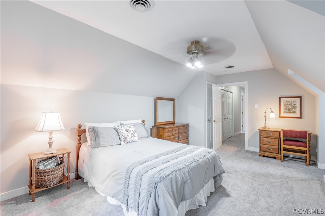 15008 Gates Mill Road Midlothian, VA 23112 - Photo 28 of 37 a bedroom with a bed and a chandelier