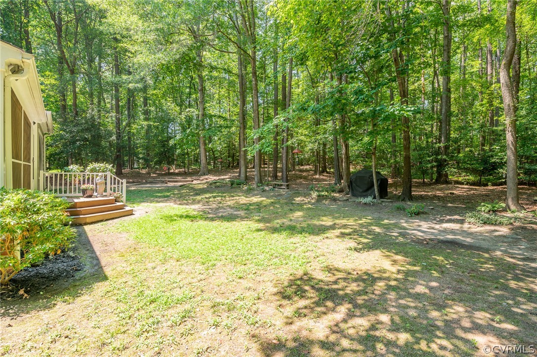 15008 Gates Mill Road Midlothian, VA 23112 - Photo 35 of 37 a view of a garden with a tree