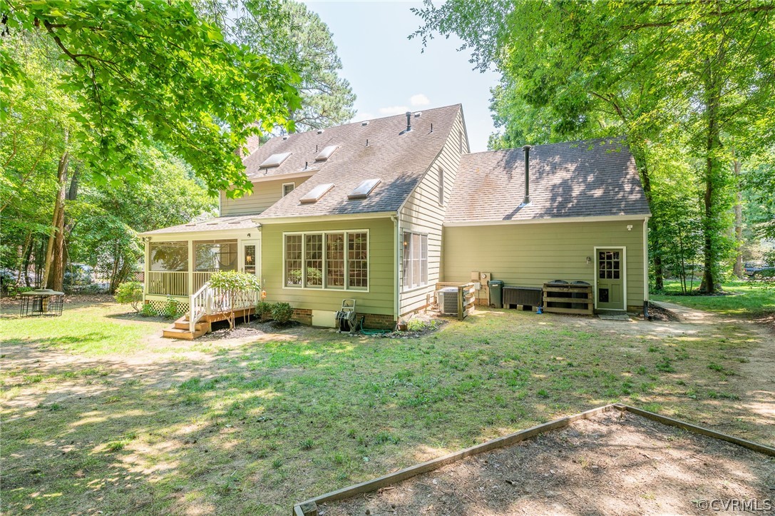 15008 Gates Mill Road Midlothian, VA 23112 - Photo 36 of 37 a view of a house with backyard sitting area and garden
