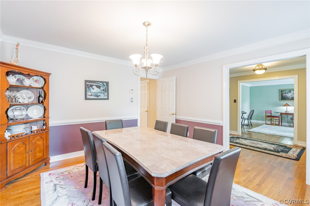 15008 Gates Mill Road Midlothian, VA 23112 - Photo 5 of 37 a view of a dining room with furniture and wooden floor