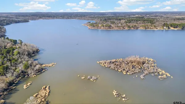 a view of a house with a snow on the road