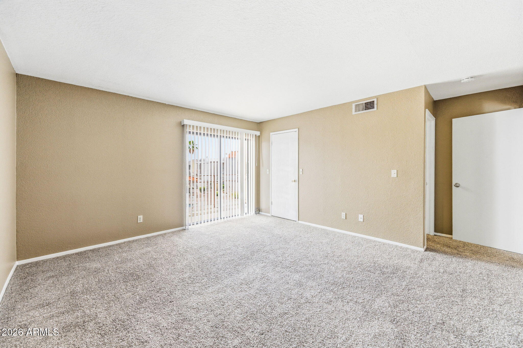 16635 North Cave Creek Road, Unit 215 Phoenix, AZ 85032 - Photo 13 of 27 a view of an empty room with a window