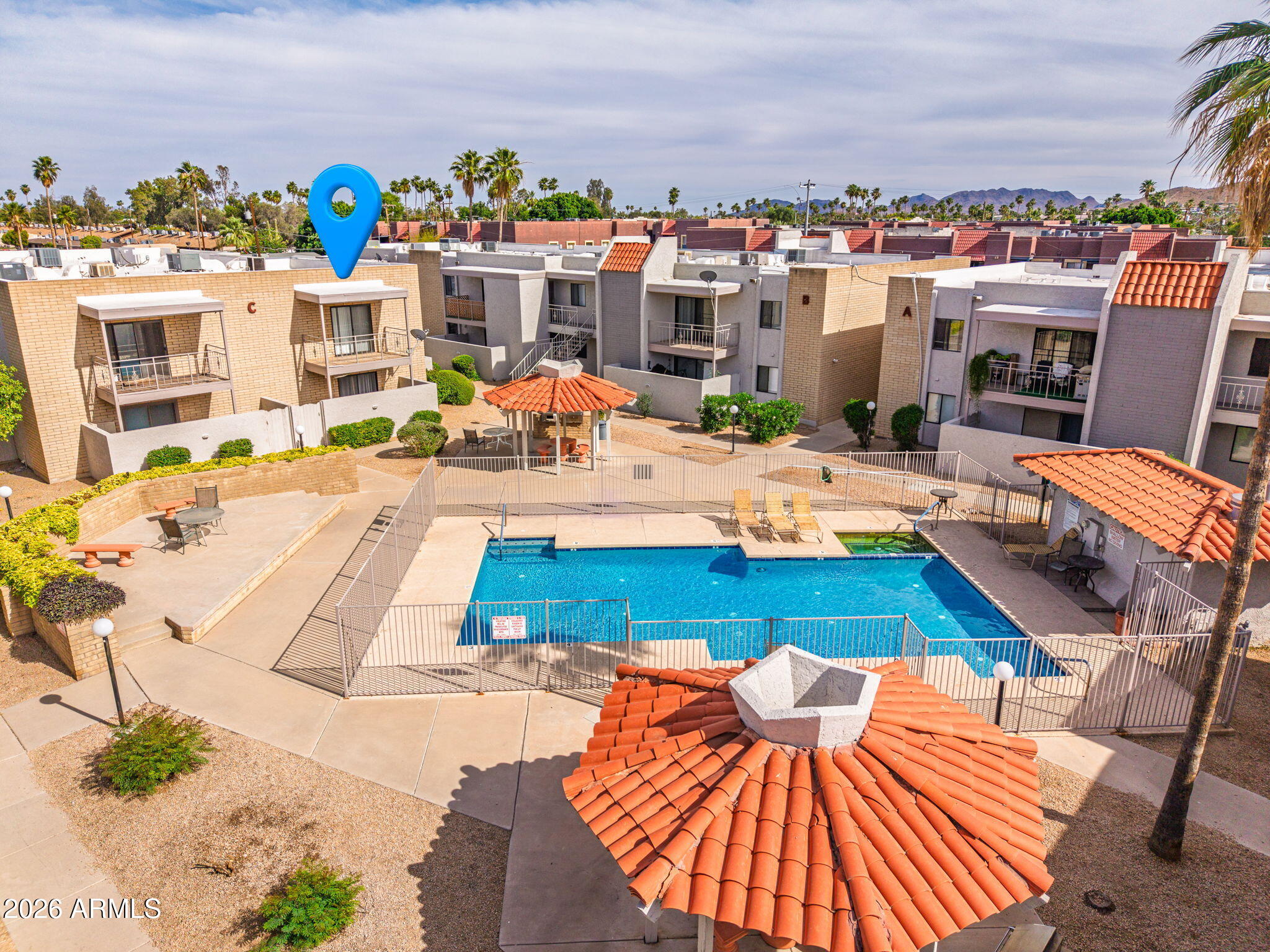 16635 North Cave Creek Road, Unit 215 Phoenix, AZ 85032 - Photo 22 of 27 a view of a swimming pool with lounge chairs