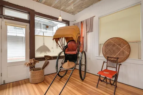 a room with furniture and wooden floor