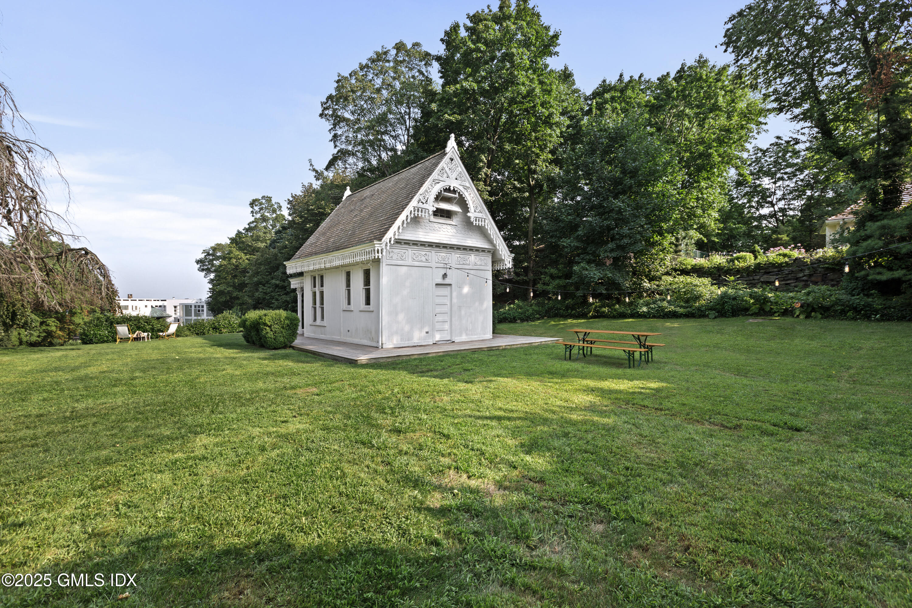 111 Byram Shore Road Greenwich, CT 06830 - Photo 18 of 23 a house with green field in front of it