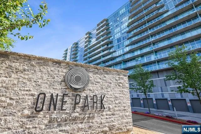 a view of outside area with brick wall and potted plants