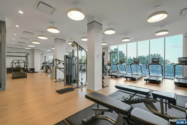 a room with lots of furniture and view of a large window