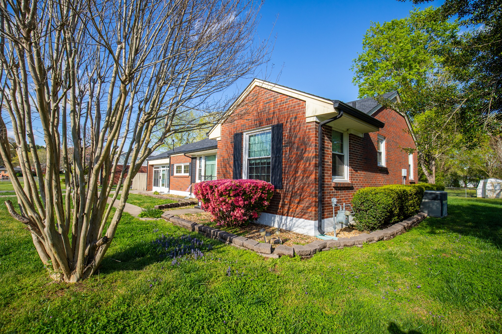 407 School Pass Madison, TN 37115 - Photo 2 of 15 a front view of a house with a yard and garage