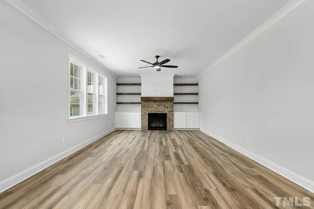 a bathroom with a glass shower door and a sink