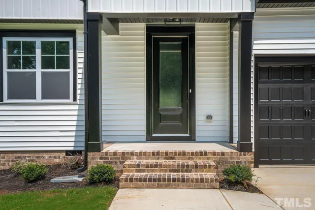 a kitchen with wooden cabinets and stainless steel appliances