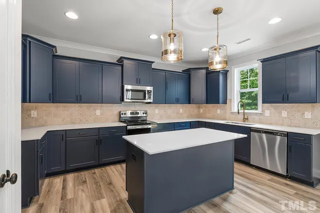 a kitchen with a sink and a window