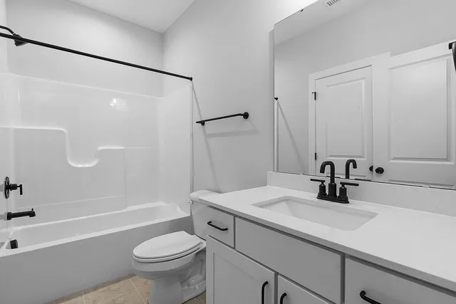 a front view of a house with garage