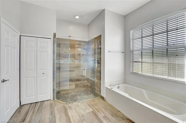 a bathroom with a shower and a bathtub