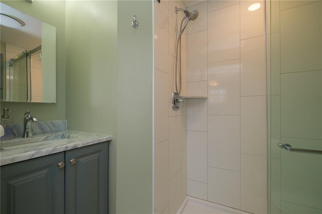 346 Wolf Run Road Industry, PA 15052 - Photo 16 of 25 a bathroom with a granite countertop sink a mirror and shower