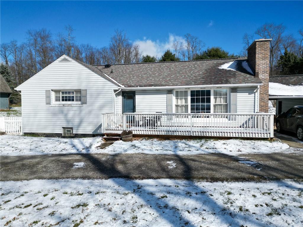 346 Wolf Run Road Industry, PA 15052 - Photo 20 of 25 a view of a white house next to a yard with large trees