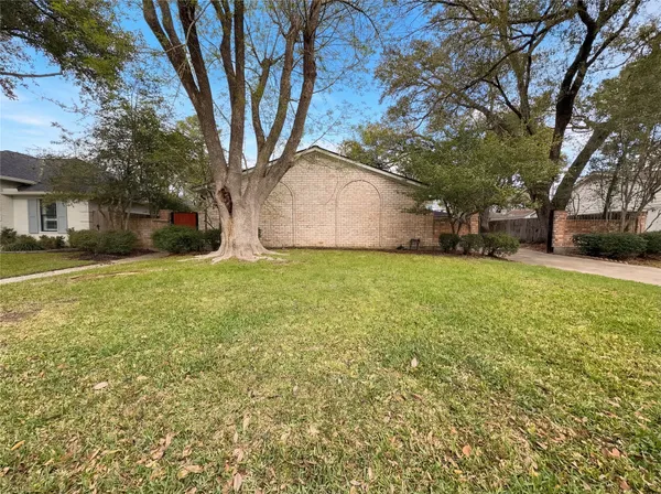 a view of a trees in front of a house
