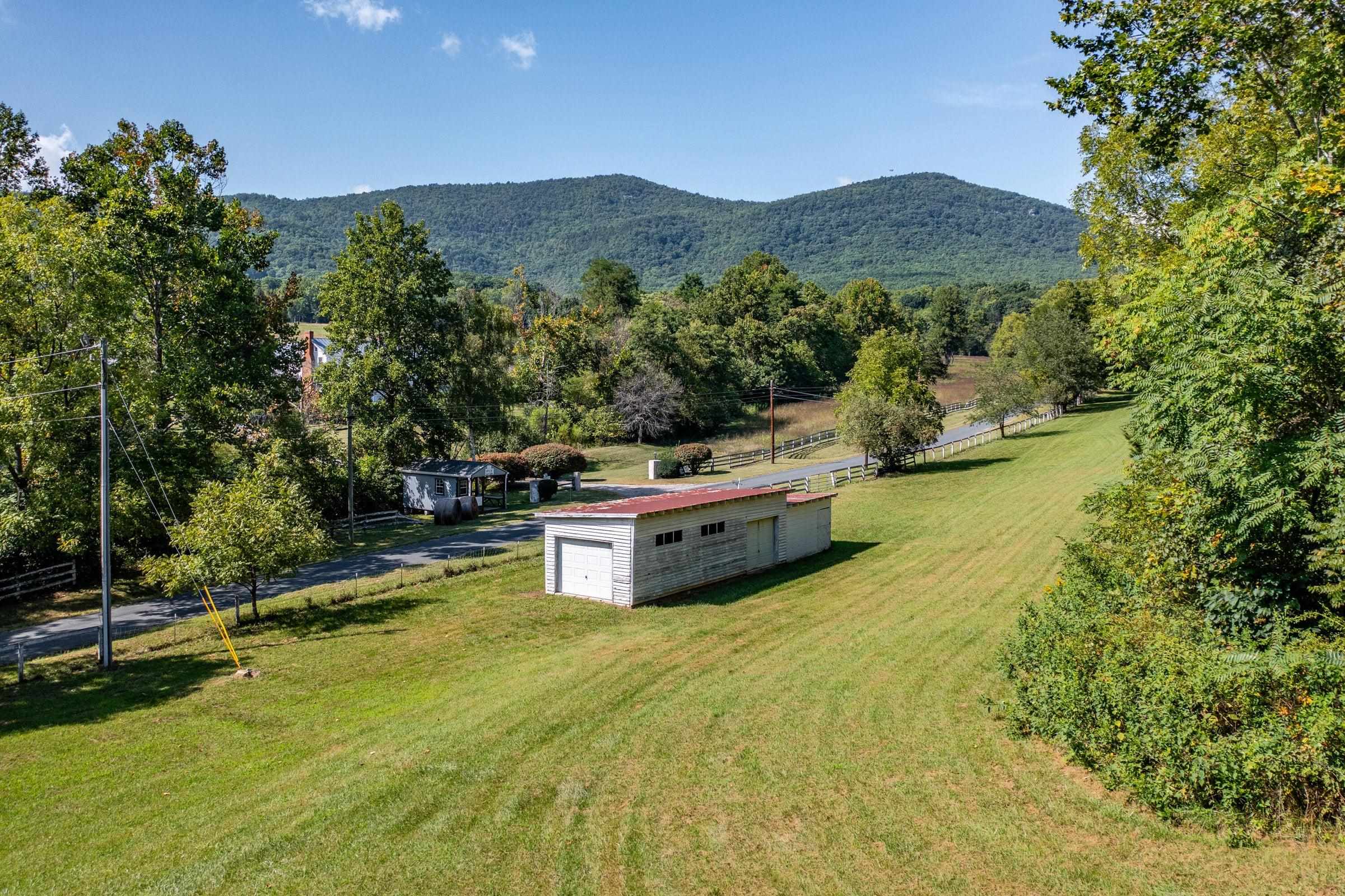 4745 Plank Road Natural Bridge, VA 24578 - Photo 11 of 75 a view of a house with pool and a yard