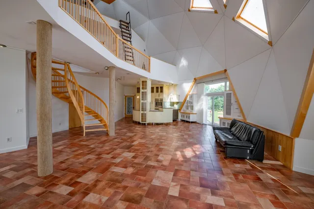 a view of an entryway with wooden floor