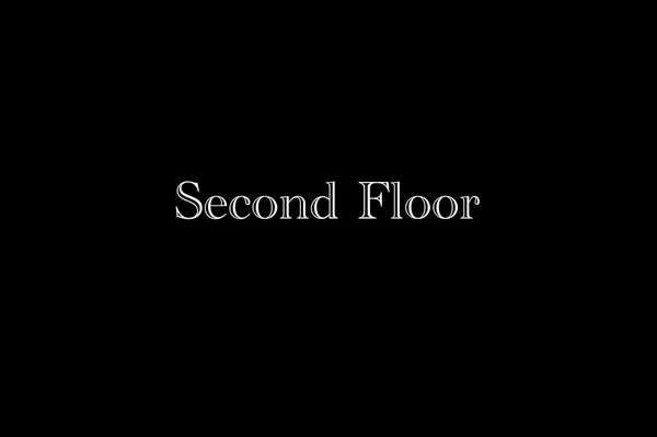 a view of a room with wooden floor and windows