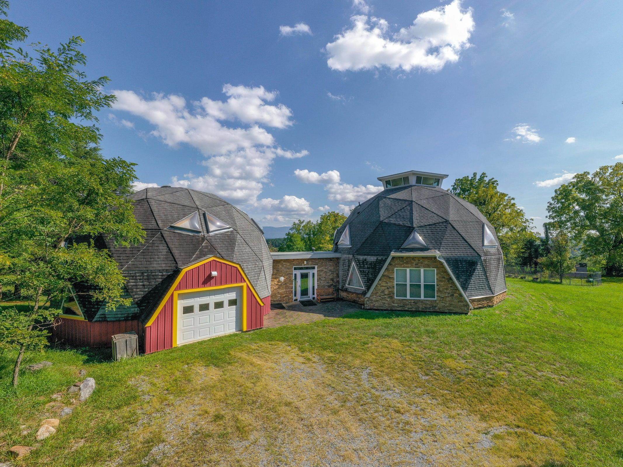 4745 Plank Road Natural Bridge, VA 24578 - Photo 5 of 75 a front view of a house with swimming pool and garden