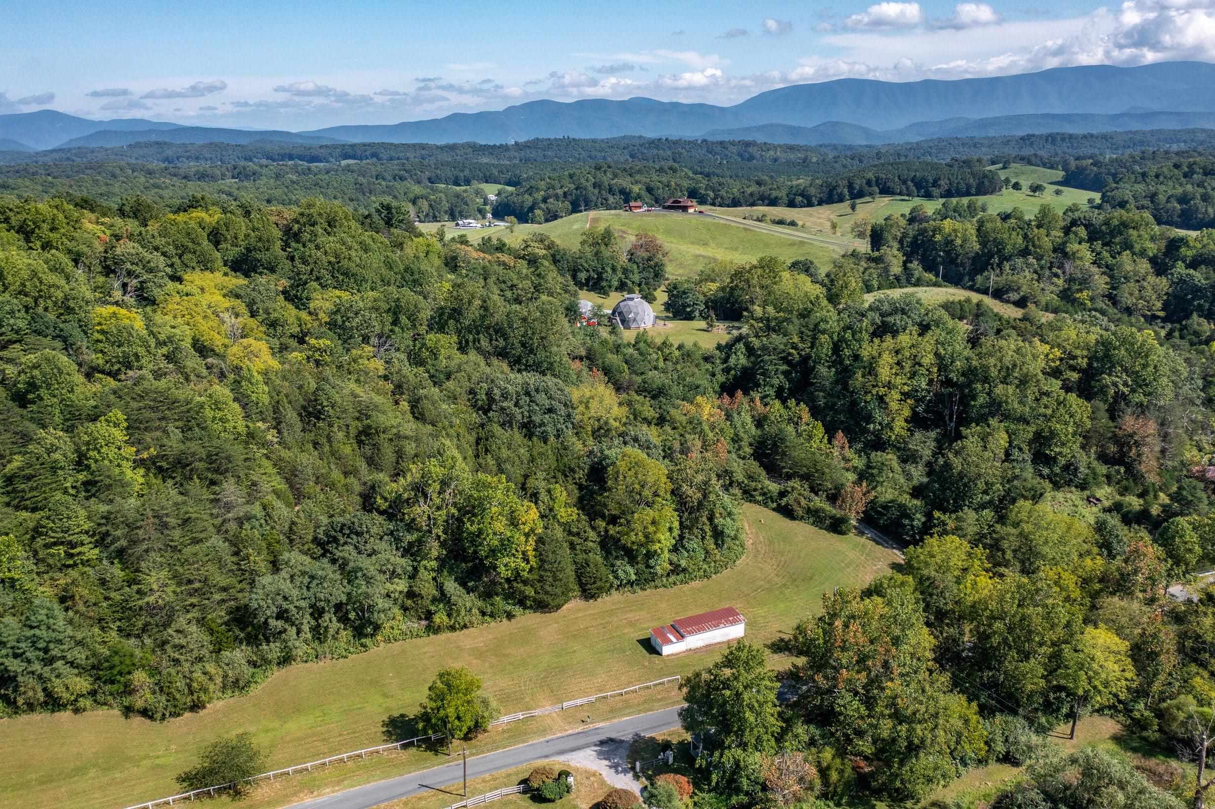 4745 Plank Road Natural Bridge, VA 24578 - Photo 10 of 75 an aerial view of a town with trees