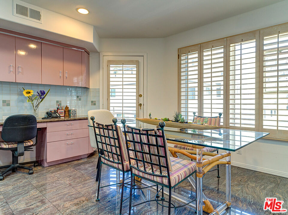 4611 Roma Court Marina del Rey, CA 90292 - Photo 11 of 26 a kitchen that has a table chairs and a window
