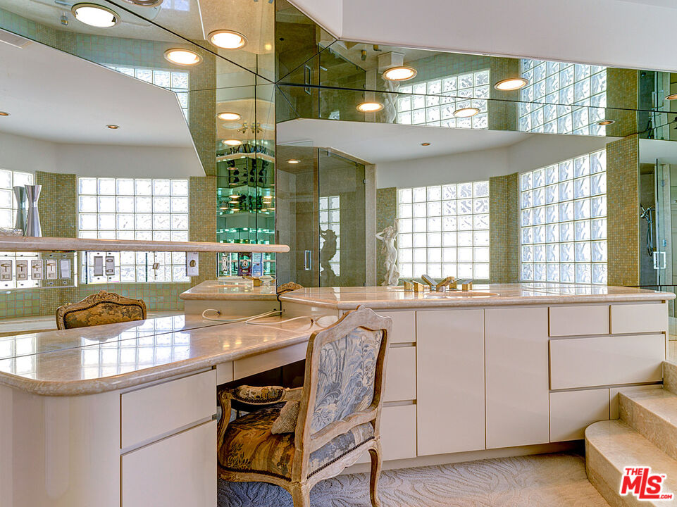 4611 Roma Court Marina del Rey, CA 90292 - Photo 16 of 26 a kitchen with stainless steel appliances granite countertop a sink and a stove