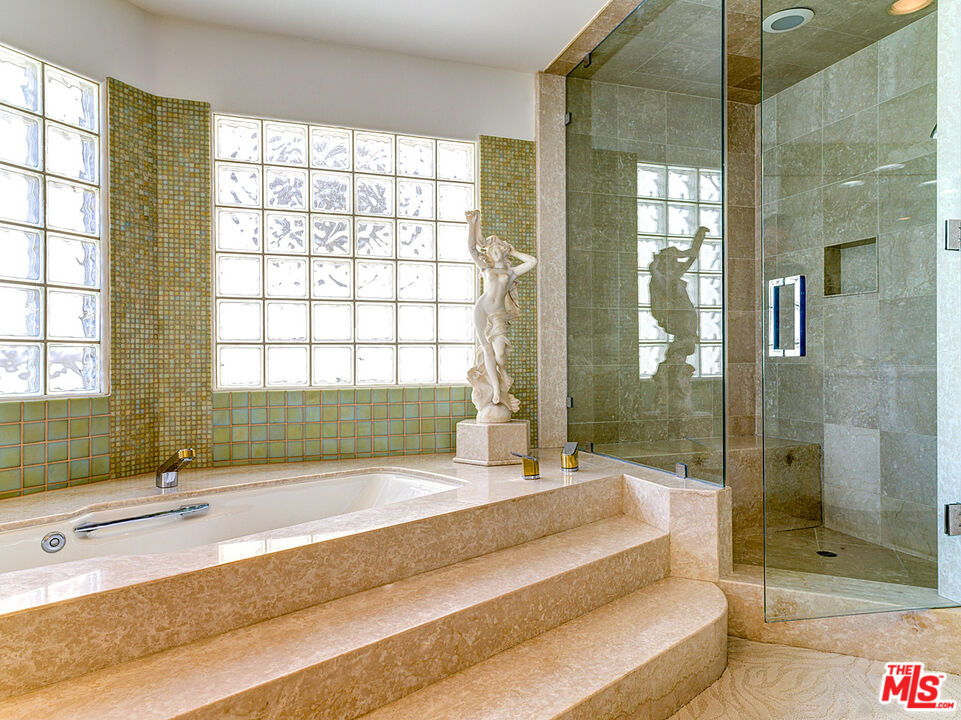 4611 Roma Court Marina del Rey, CA 90292 - Photo 18 of 26 a spacious bathroom with a tub shower and windows