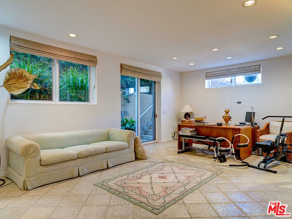 4611 Roma Court Marina del Rey, CA 90292 - Photo 3 of 26 a living room with furniture a window and a chandelier