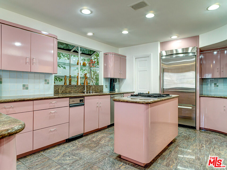 4611 Roma Court Marina del Rey, CA 90292 - Photo 8 of 26 a kitchen with stainless steel appliances granite countertop a stove a sink and a refrigerator
