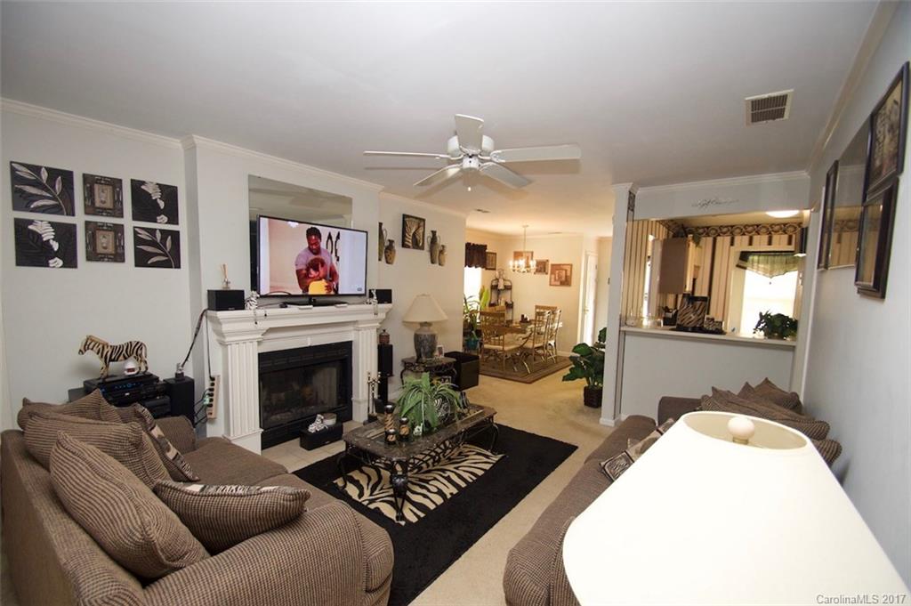 6728 Bevington Ridge Road Charlotte, NC 28277 - Photo 8 of 8 a living room with furniture and a fireplace