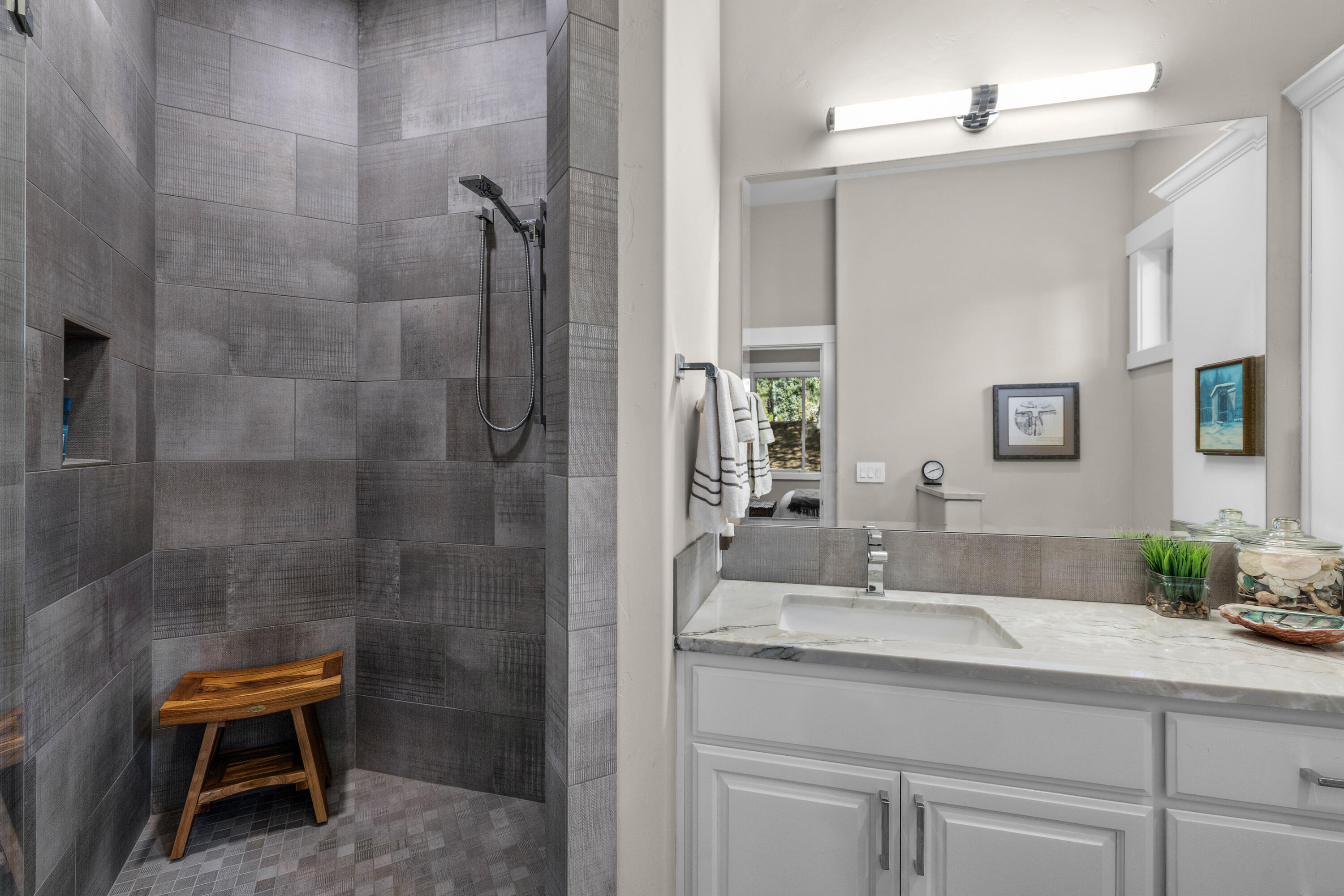19460 Chip Shot Lane Bend, OR 97702 - Photo 34 of 56 a bathroom with a granite countertop sink a toilet and shower