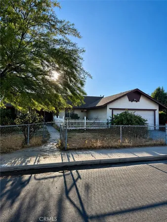 a view of house with a yard