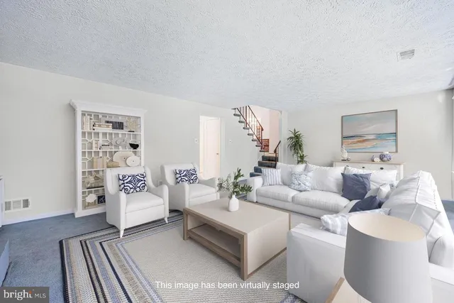 a living room with furniture and a couch