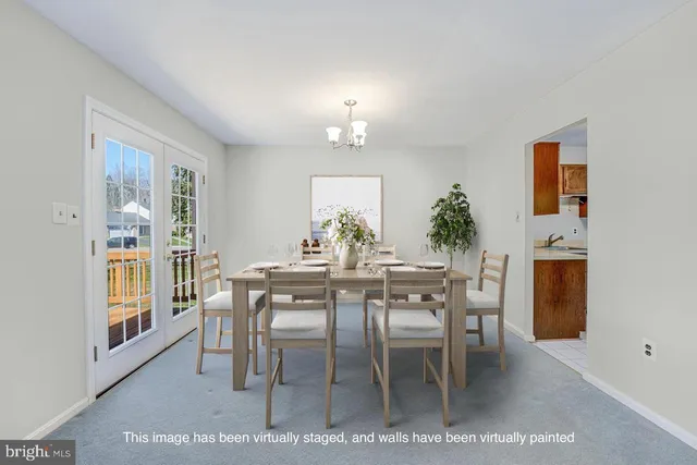 a view of a dining room with furniture and window