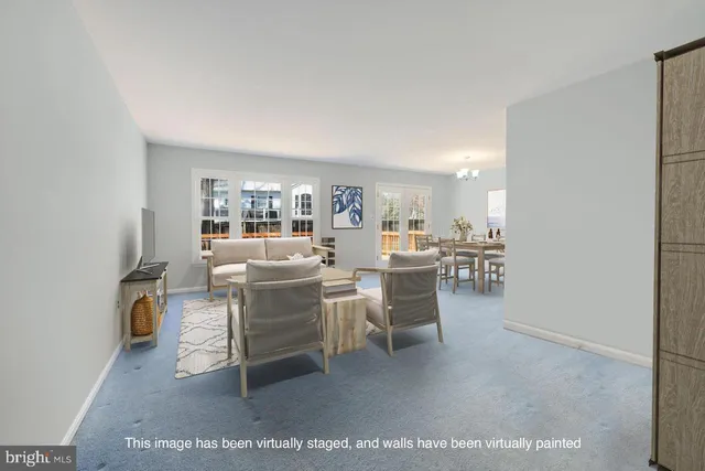 a dining room with a table and chairs