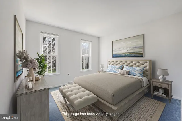 a bedroom with a large bed and a couch