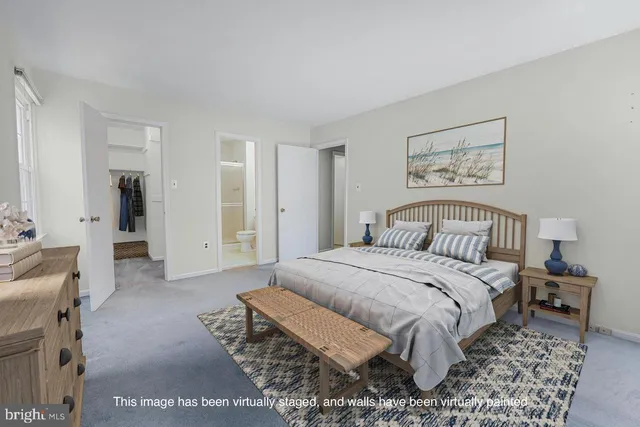 a spacious bedroom with a bed and a couch